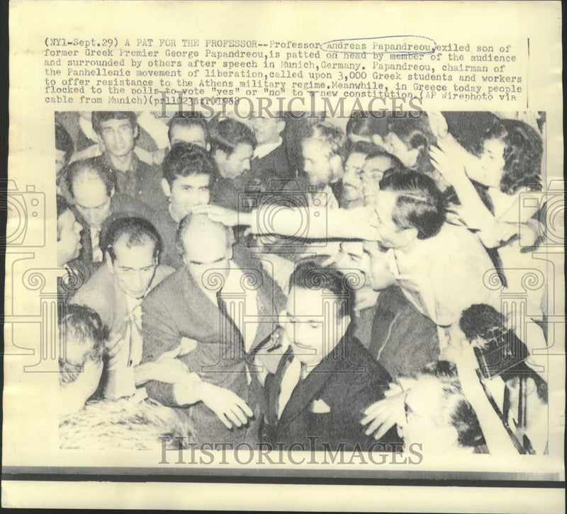 Load image into Gallery viewer, 1968 Press Photo Andreas Papandreou patted on head after speech in Munich

