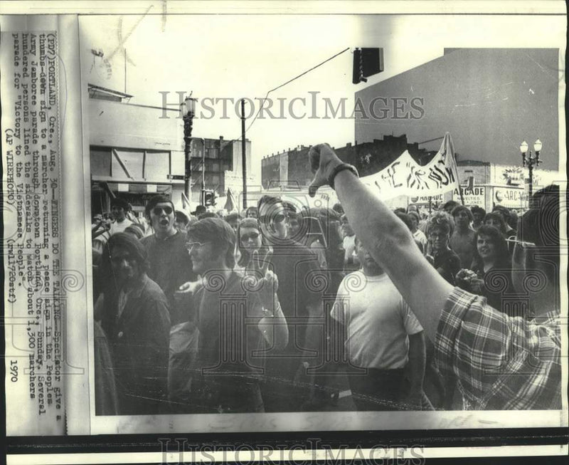 Load image into Gallery viewer, 1970 Press Photo Peoples' Army Jamboree parade spectator gives thumbs-down, OR
