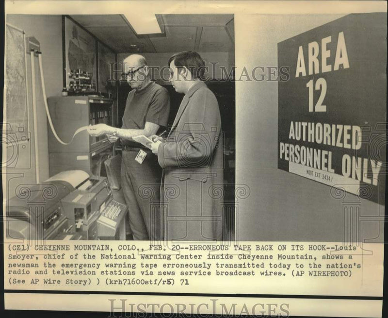 Load image into Gallery viewer, 1971 Press Photo Louis Smoyer and newsman at National Warning Center in Colorado
