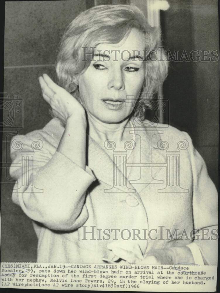 1966 Press Photo Candace Mossler pats wind-blown hair at court arrival in Miami