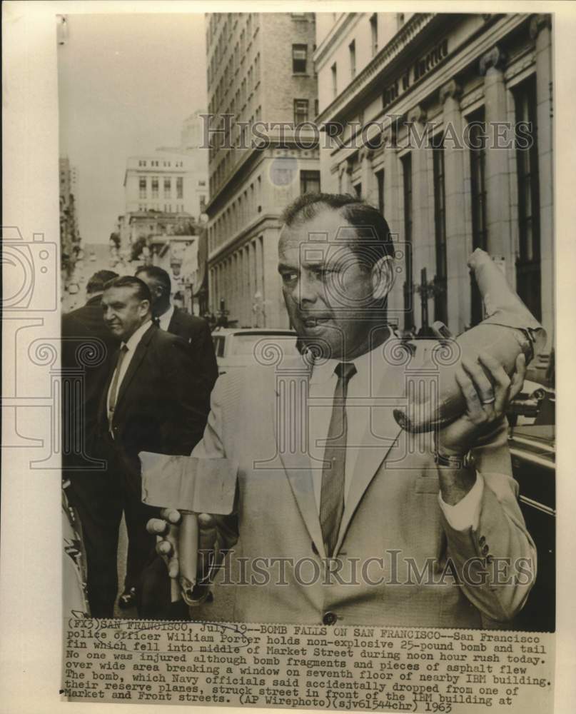 1963 Press Photo William Porter holds objects dropped from Navy plane in CA