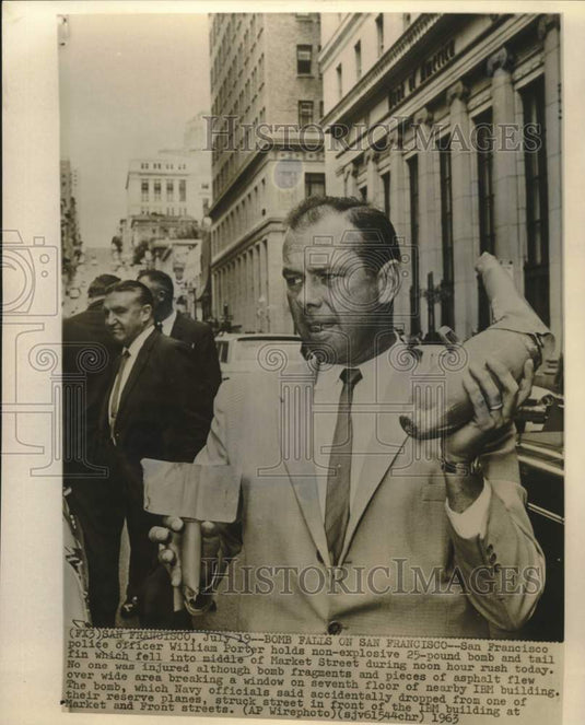 1963 Press Photo William Porter holds objects dropped from Navy plane in CA