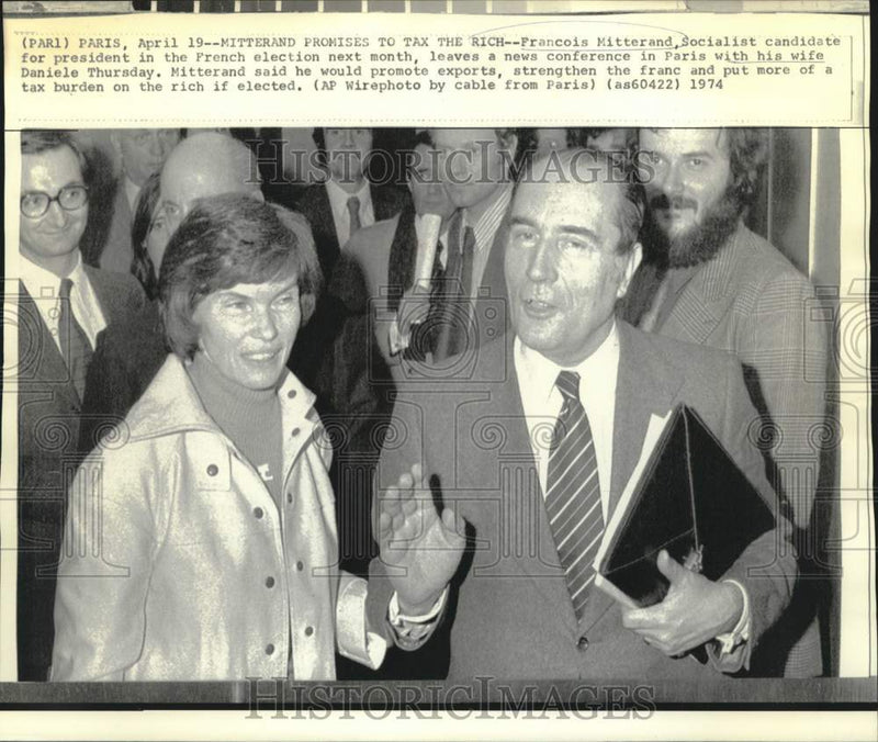 Load image into Gallery viewer, 1974 Press Photo Francois Mitterrand and wife leave Paris press conference
