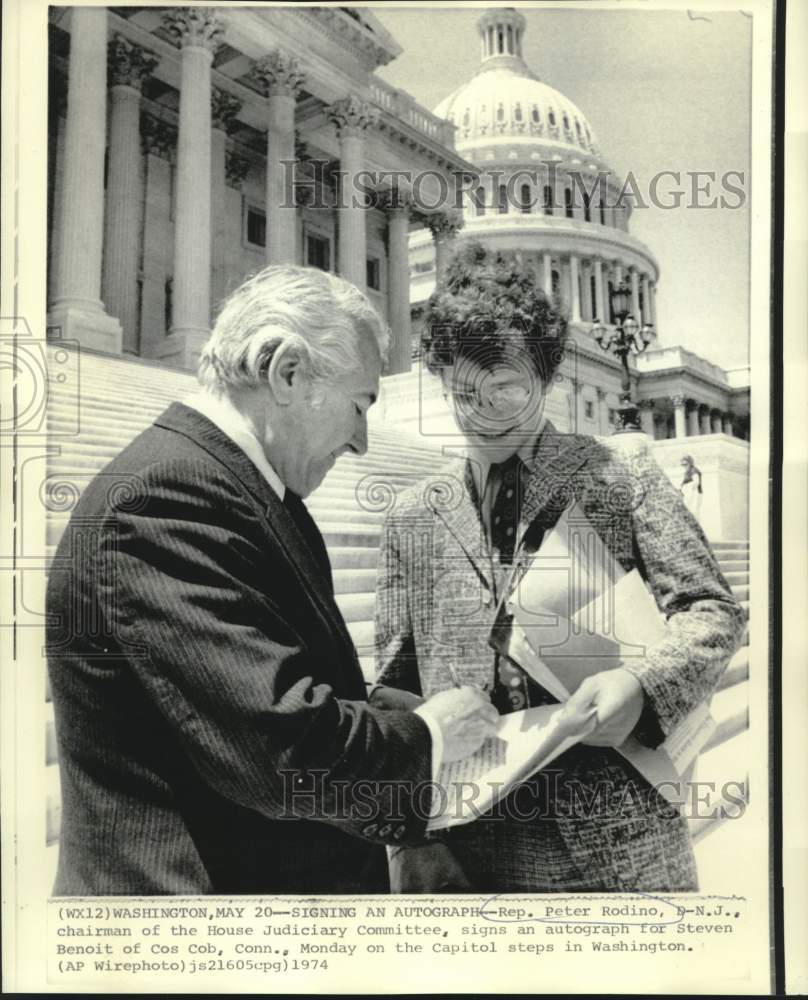 1974 Press Photo Representative Peter Rodino signs autograph for Steven Benoit
