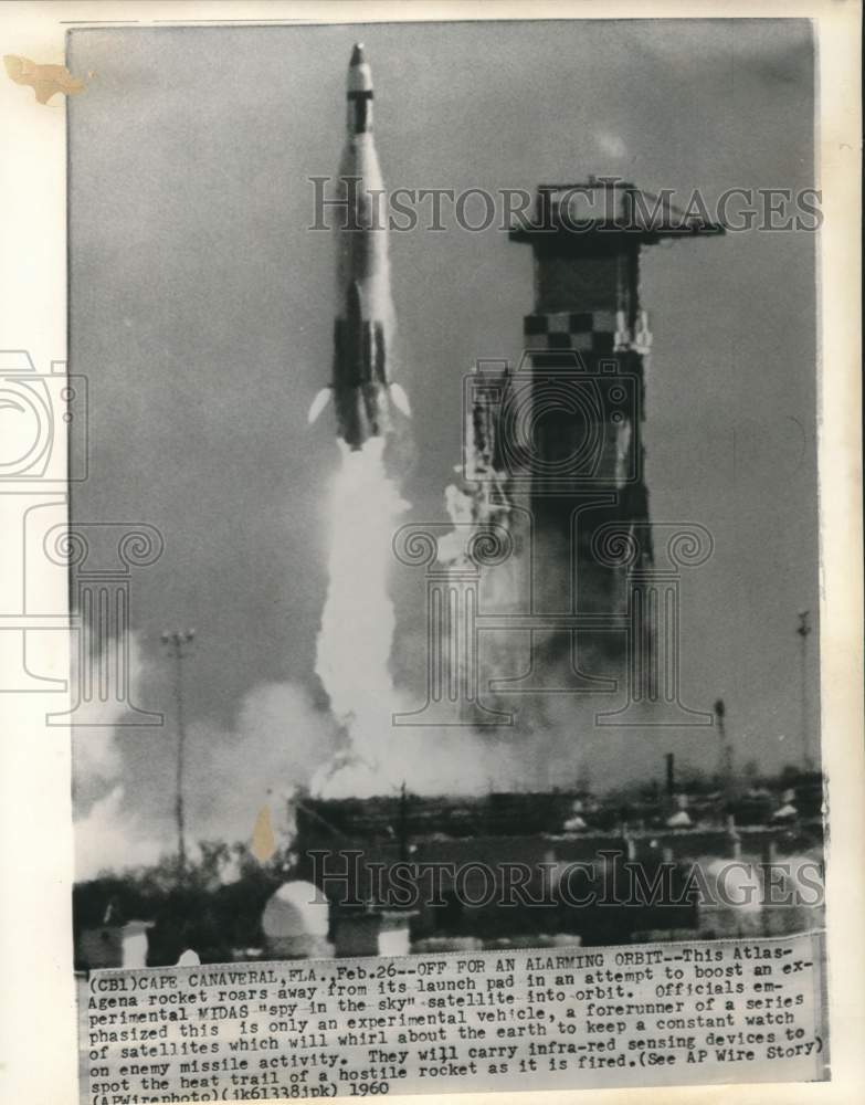 Load image into Gallery viewer, 1960 Press Photo An Atlas-Agena rocket roars from its launch pad, Cape Canaveral
