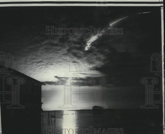 Press Photo Titan 3 streaks orbit-ward above boathouses near Cape Kennedy