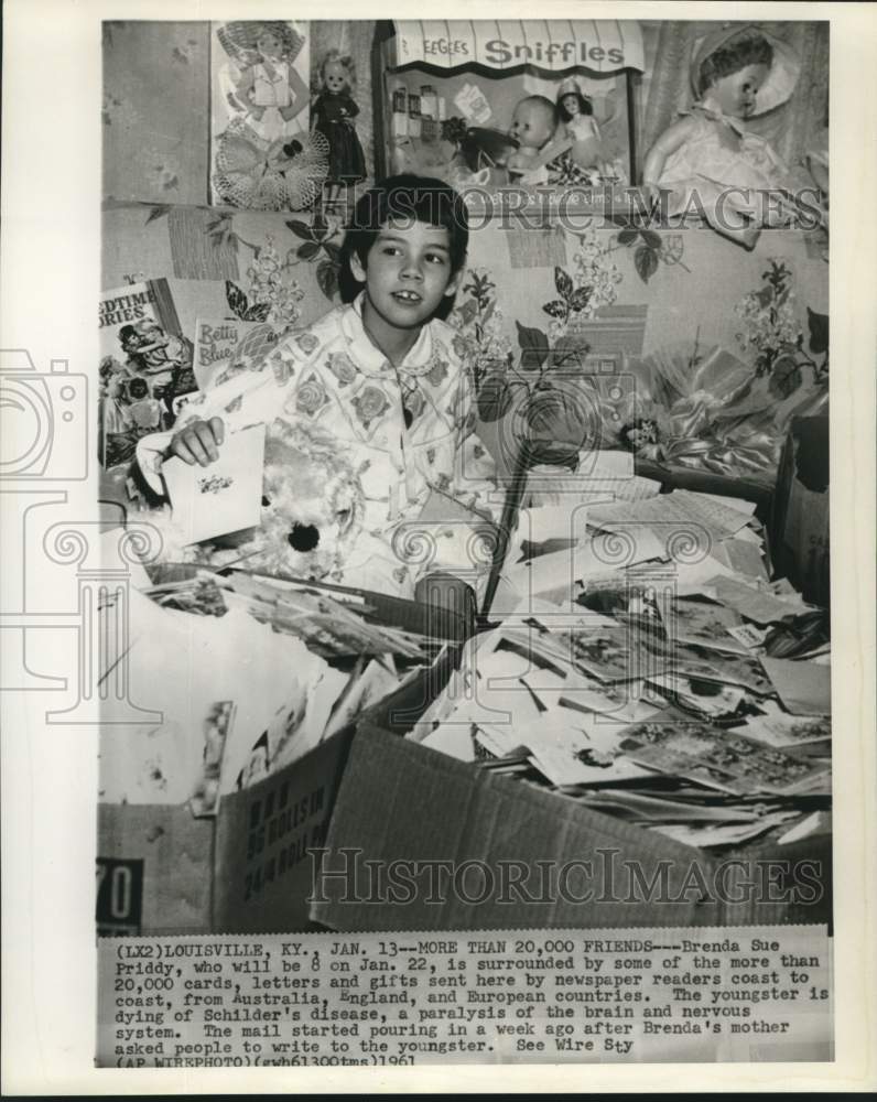 Load image into Gallery viewer, 1961 Press Photo Schilder's disease victim Brenda Sue Priddy receives gifts

