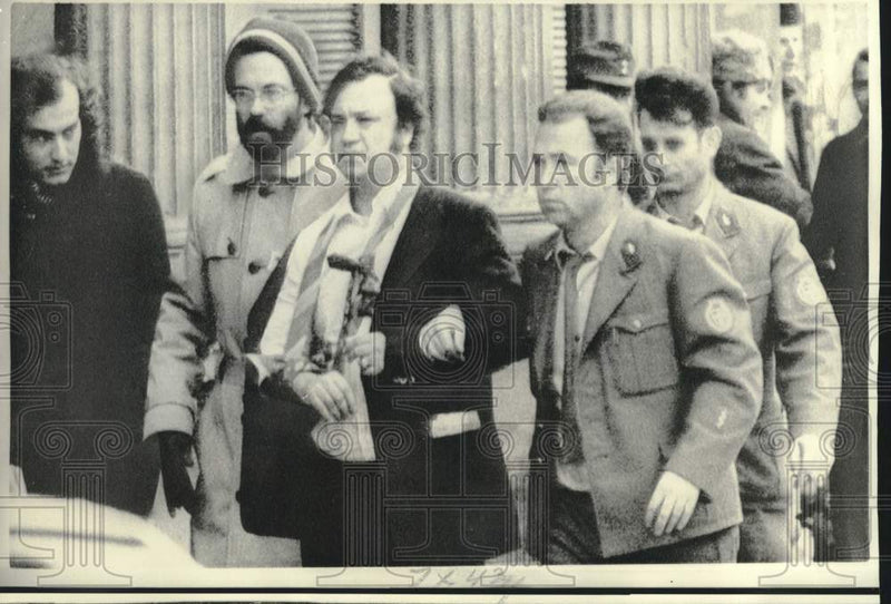 Load image into Gallery viewer, 1975 Press Photo Kuwaiti delegate Dr. Mohammed Nasser escorted to ambulance

