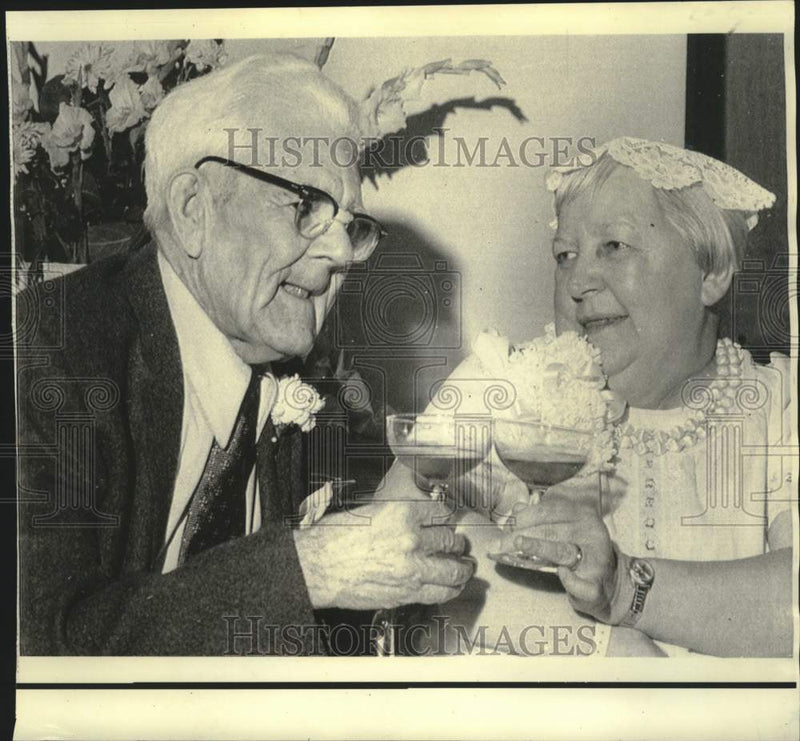 Load image into Gallery viewer, 1971 Press Photo Mr. and Mrs. Virgil Lee Ramsey toast after CA wedding ceremony
