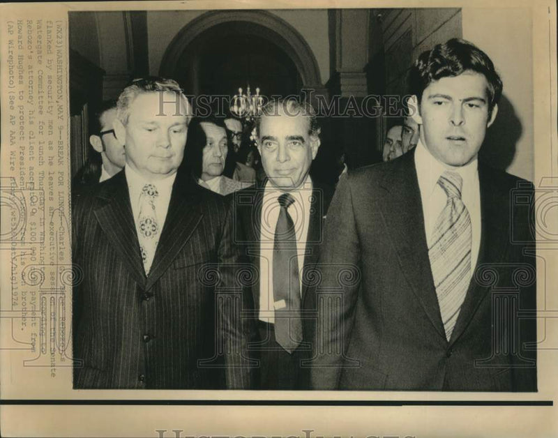 Load image into Gallery viewer, 1974 Press Photo Under security Charles Rebozo leaves Watergate hearing
