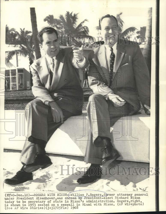1953 Press Photo William Rogers and Richard Nixon sit on seawall in Miami, FL