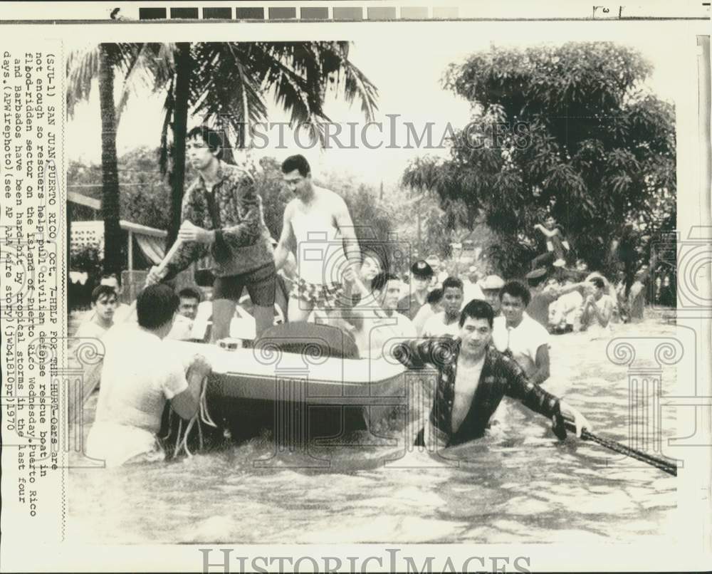 1970 Press Photo Rescuers Pull Boat in Flooded Area of Puerto Rico - now39459