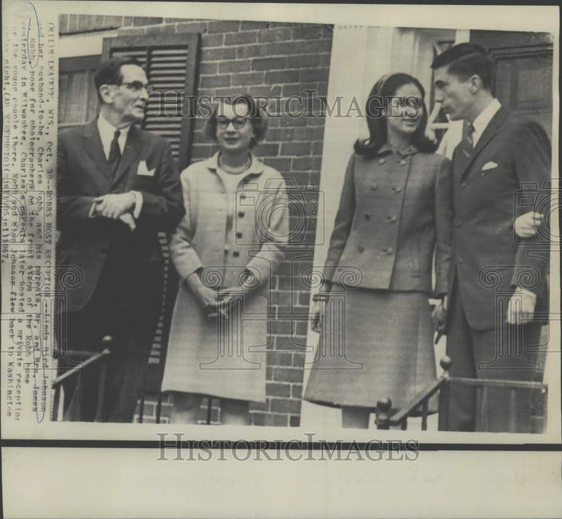 Load image into Gallery viewer, 1967 Press Photo Lynda Johnson, fiancee Charles Robb &amp; his parents at home, WI.
