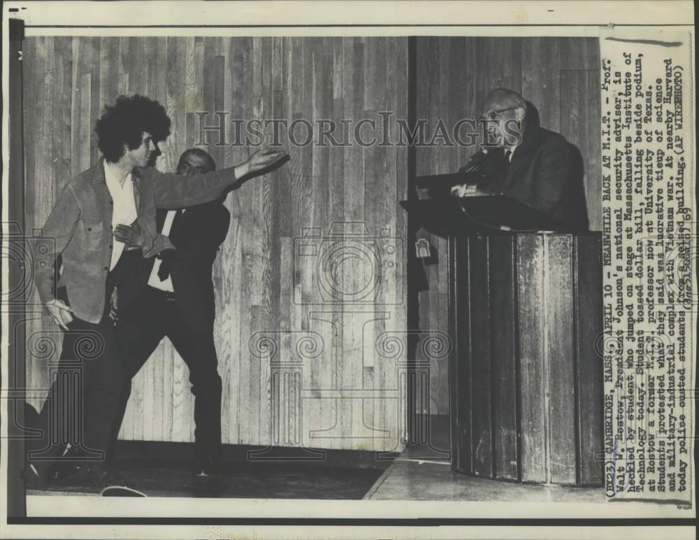 1969 Press Photo A student protests Prof. Walt Rostow on stage in Massachusetts