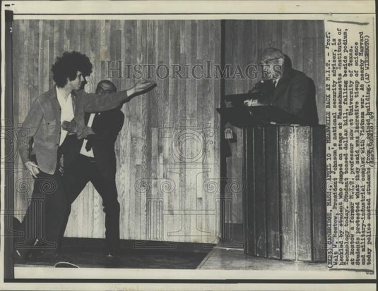1969 Press Photo A student protests Prof. Walt Rostow on stage in Massachusetts