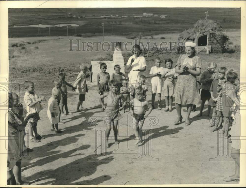 Press Photo Children of Russian Marine Tractor Station with Women Caretakers