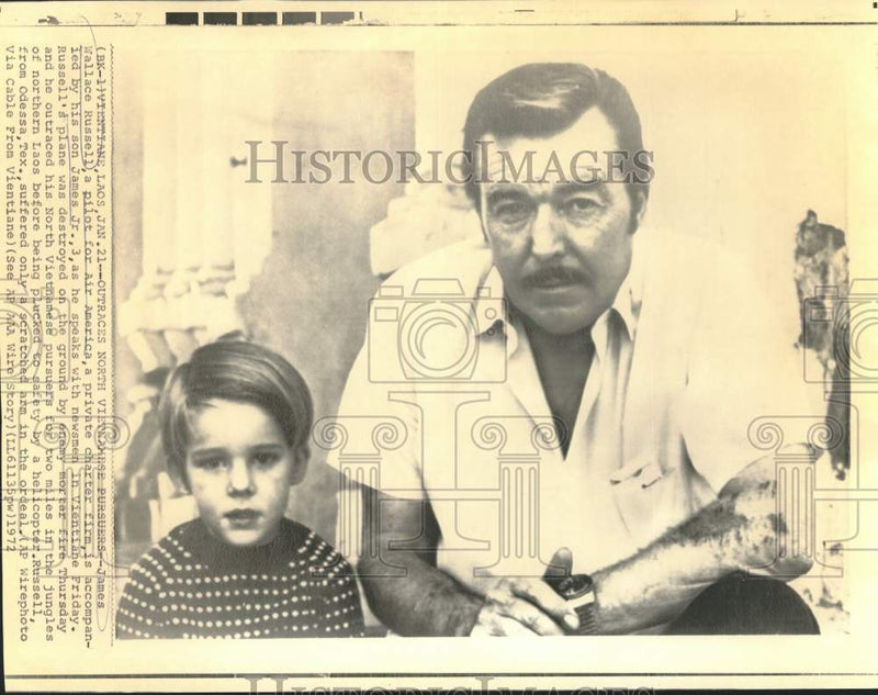Load image into Gallery viewer, 1972 Press Photo Air America Pilot James Wallace Russell &amp; Son with Laos Press
