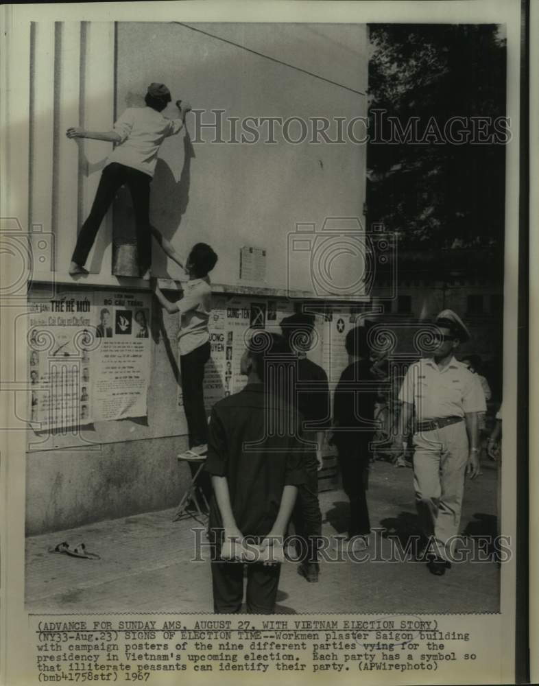 1967 Press Photo Presidential Candidates&#39; Campaign Posters Put up in Saigon