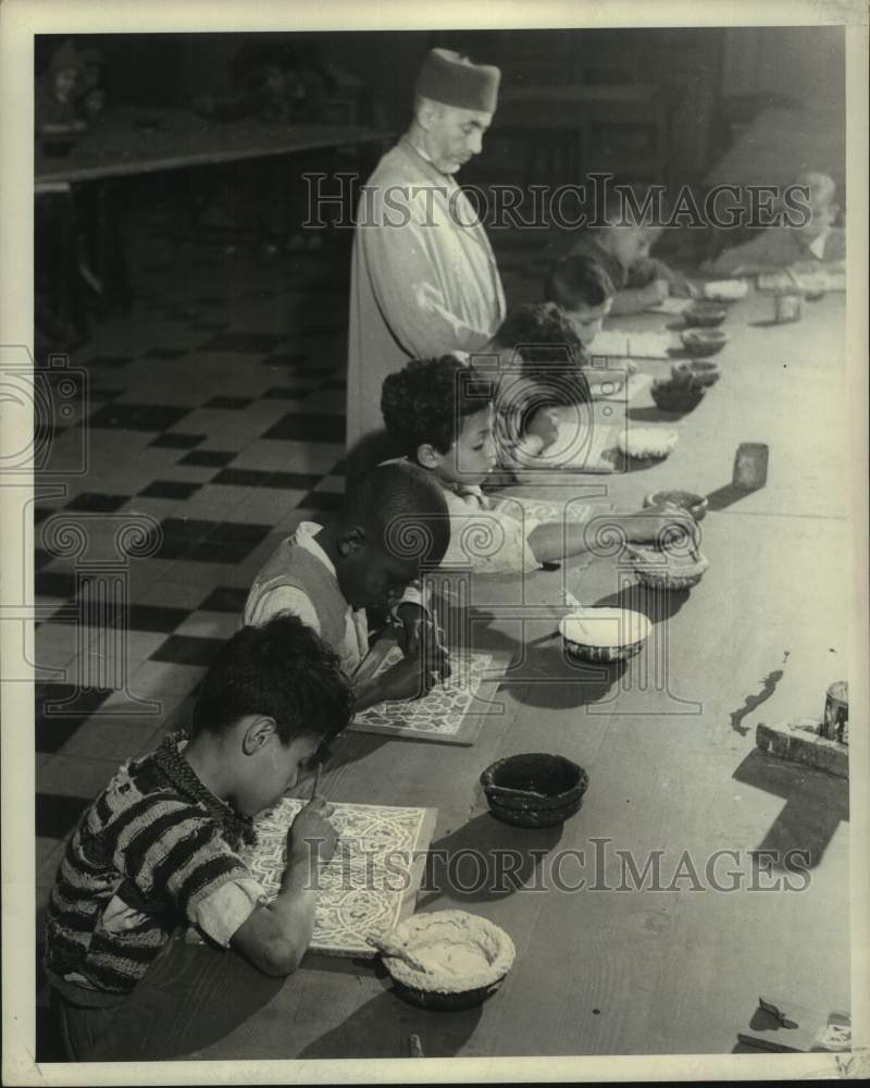 1967 Press Photo Trainee Artisans Learn Wood Carving, Painting, Morocco