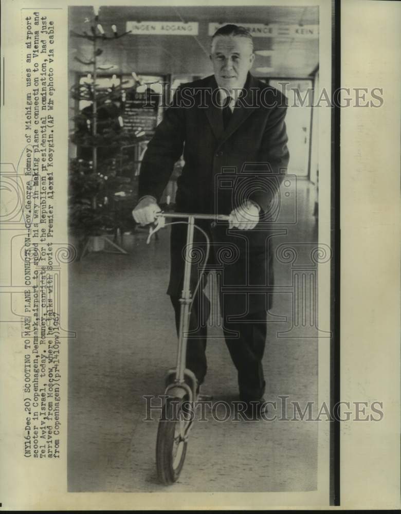 Load image into Gallery viewer, 1967 Press Photo Governor George Romney uses airport scooter in Copenhagen
