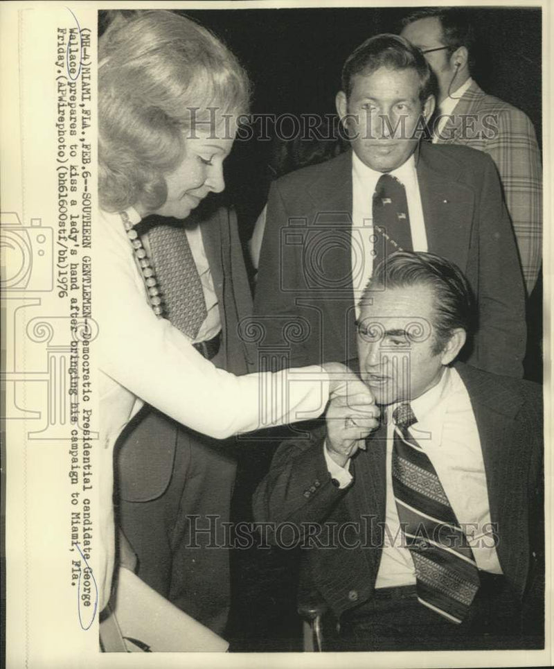 Load image into Gallery viewer, 1976 Press Photo George Wallace kisses a lady's hand during campaign in Miami

