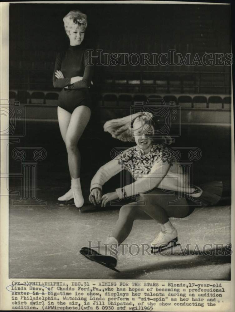 1965 Press Photo Linda Snow, figure skater, in action, as Jill Shipstad looks on- Historic Images