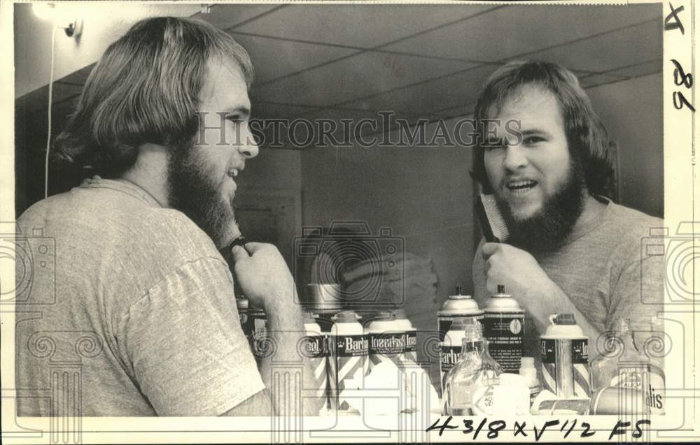 1974 Press Photo Pat Toomay shown brushing his facial hair - now55745- Historic Images