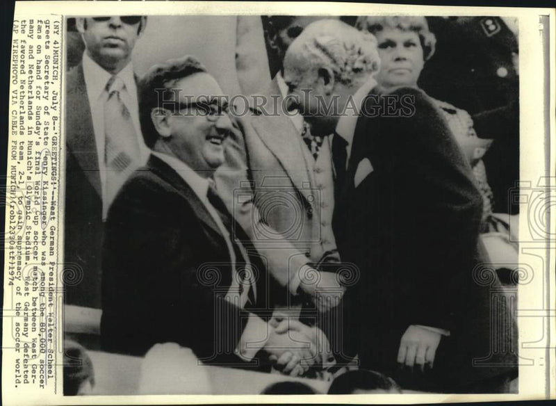 Load image into Gallery viewer, 1974 Press Photo Walter Schael greets Henry Kissinger at World Cup soccer game

