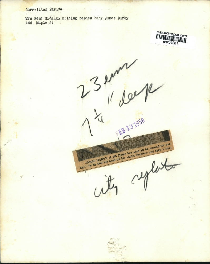 1950 Press Photo Rene Hidalgo holding nephew James Darby after Carrollton Parade