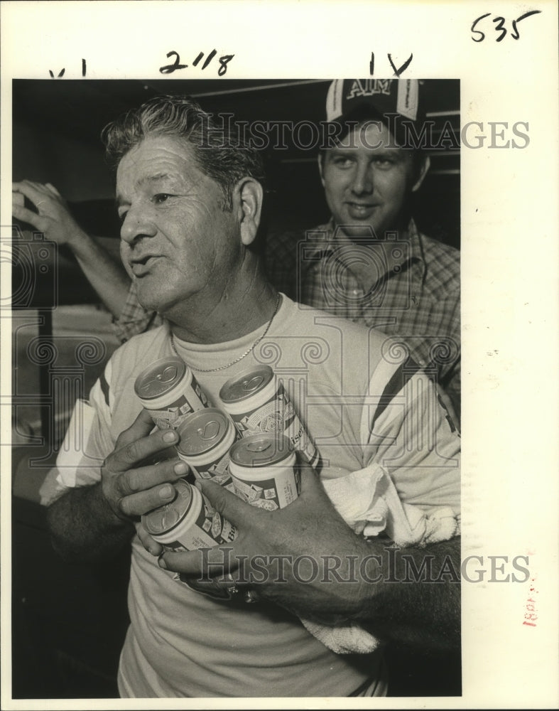Load image into Gallery viewer, 1981 Press Photo "The Chief" carries beverages on to the Bum Special, Saints Fan
