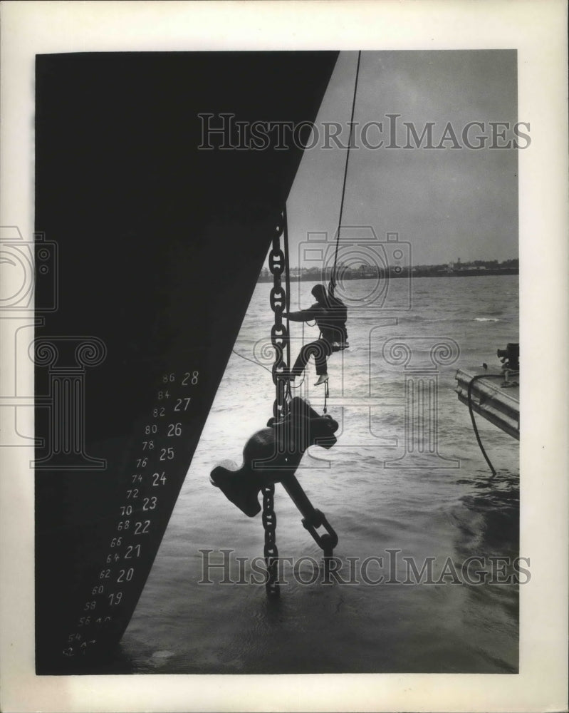 Load image into Gallery viewer, 1965 Press Photo Hurricane Betsy - Man Checking Out Ship Damage - nox01591
