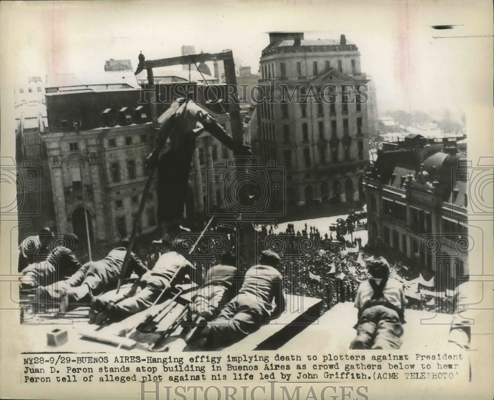 1948 Press Photo Hanging effigy stands atop building in Buenos Aires, Argentina- Historic Images