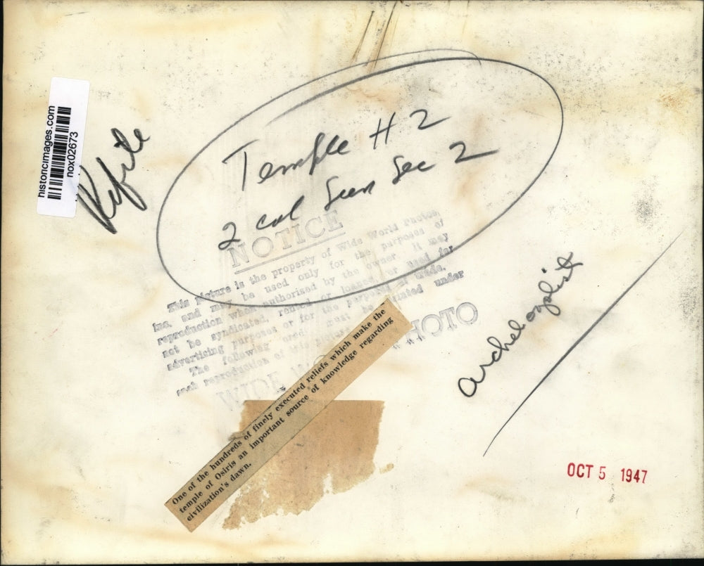 1947 Press Photo Man looks at reliefs at temple of Osiris - nox02673