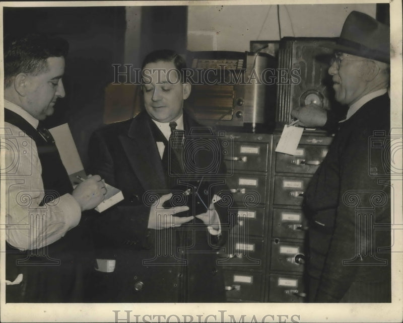 Load image into Gallery viewer, 1942 Press Photo Sergeant John Soulant receives camera from German Paul Elzholz.
