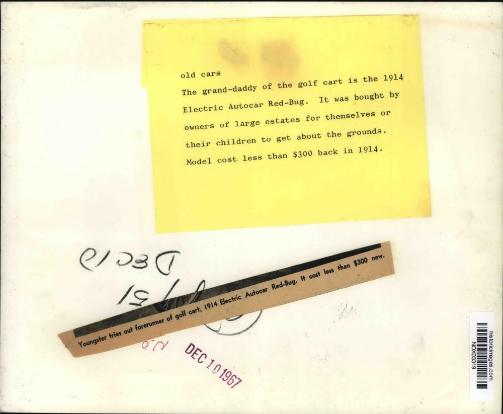 1967 Press Photo A boy plays in a 1914 Electric Autocar Red-bug golf cart.