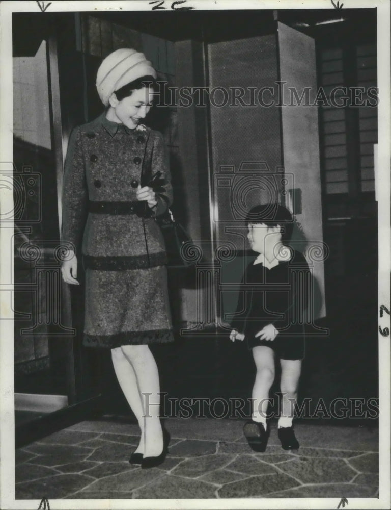 Load image into Gallery viewer, 1969 Press Photo Prince Aya leaves Togu Palace with Crown Princess Michiko.
