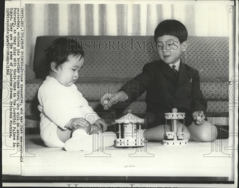 Load image into Gallery viewer, 1966 Press Photo Prince Ayanomiya watches Prince Hiro play with toys, Japan
