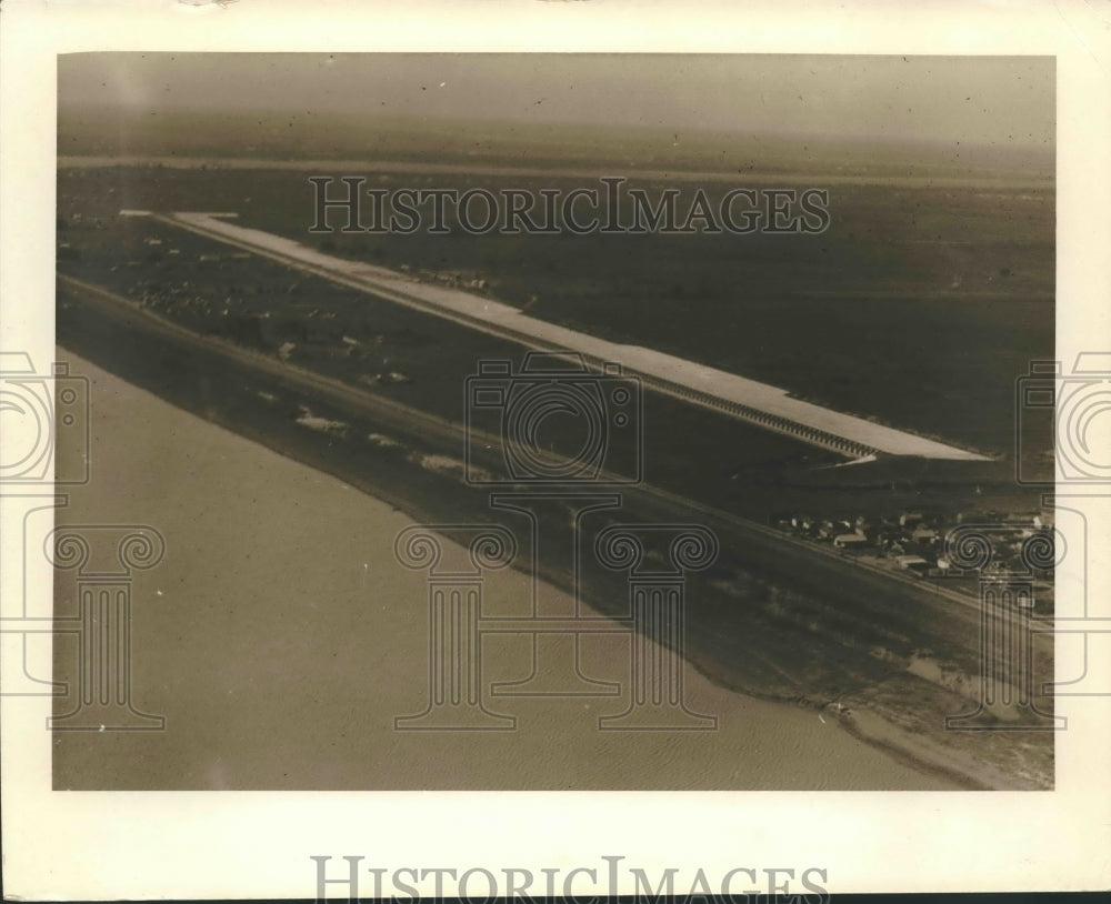 Press Photo Aerial view of Spillway - Telegraph poles mark road to be submerged