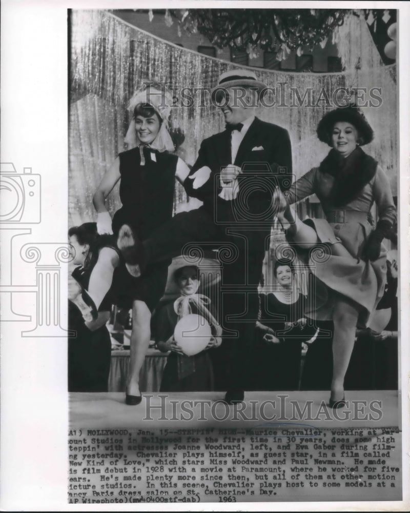 Load image into Gallery viewer, 1963 Press Photo Maurice Chevalier, Eva Gabor and Joanne Woodward high steppin'
