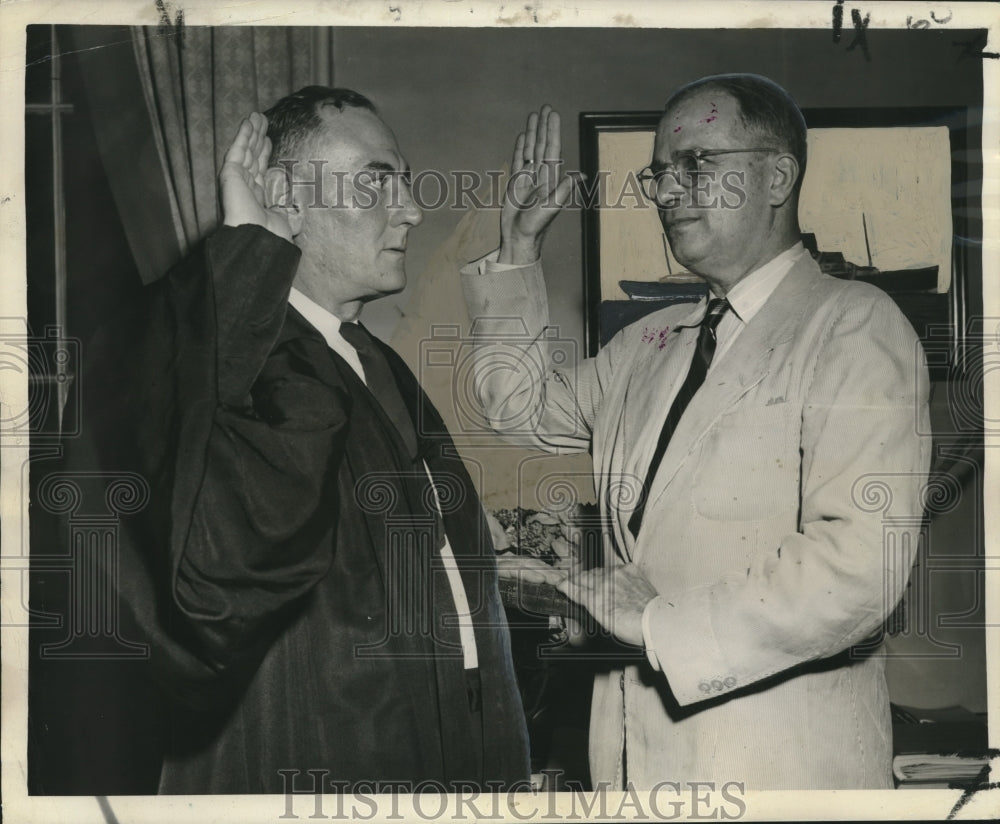 1950 Press Photo Reappointed as city attorney Monday was Henry B. Curtis, Oath