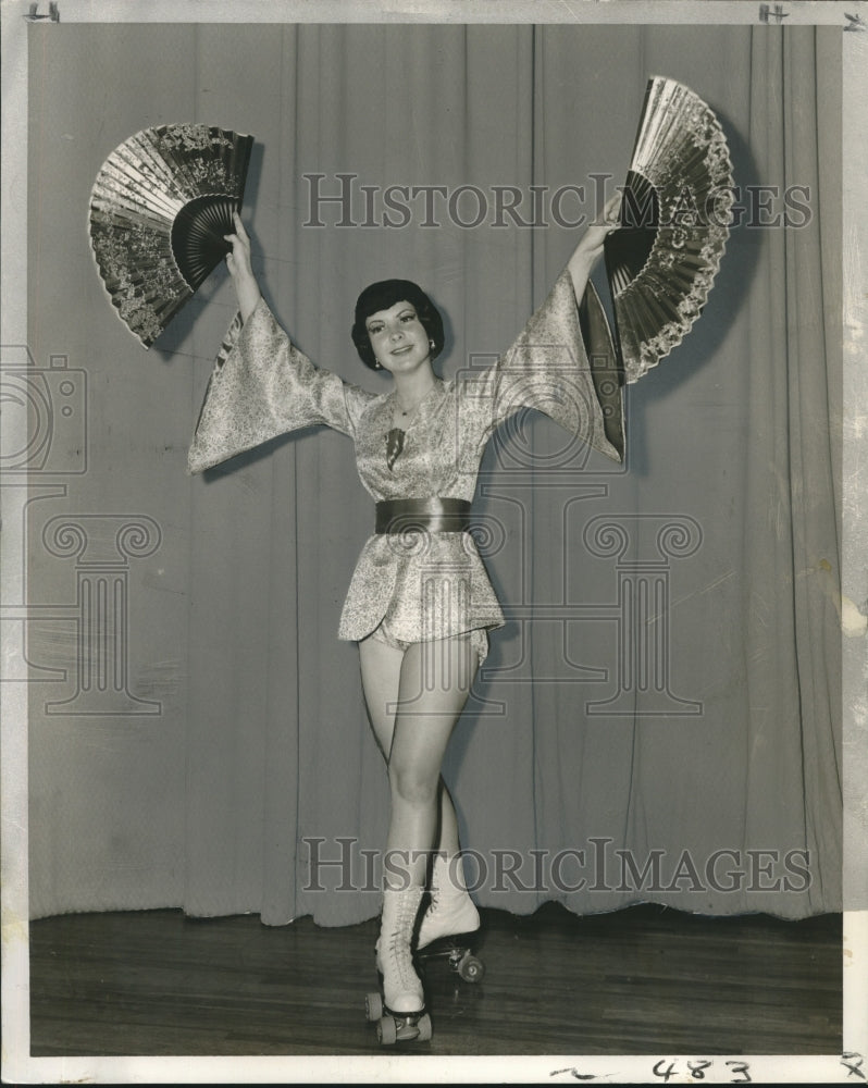 Load image into Gallery viewer, 1959 Press Photo Miss Lenora Desroche with Oriental Fans and Roller Skates
