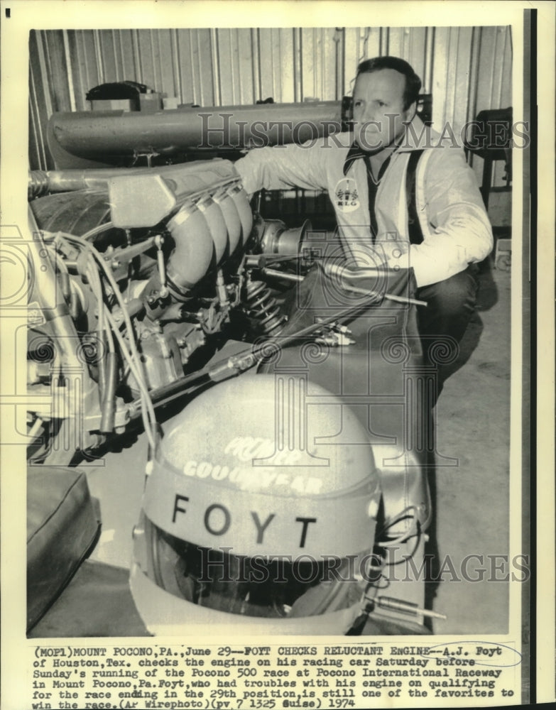 Load image into Gallery viewer, 1974 Press Photo A. J. Foyt Checks Race Car Engine Prior to Pocono 500 Race
