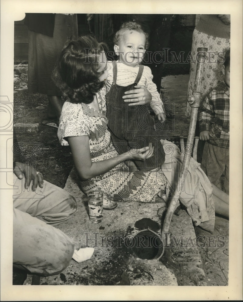 Load image into Gallery viewer, 1955 Press Photo Mrs. George Elmer assisted police in extracting Gary from sewer
