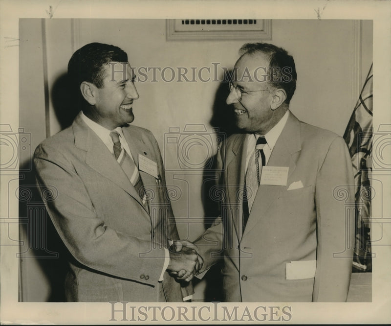 Load image into Gallery viewer, 1949 Press Photo T.E. Melton &amp; J.S. Fraering shake hands at event - nox21181
