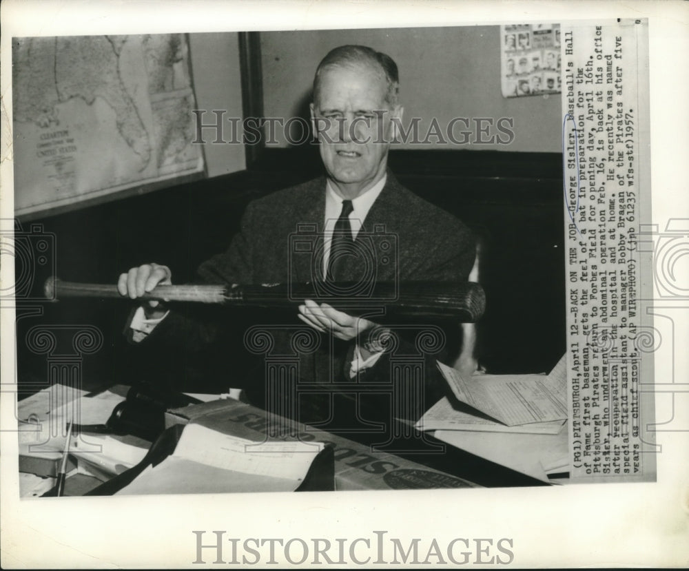 1957 Press Photo George Sisler, Hall of Fame first baseman, gets feel for bat