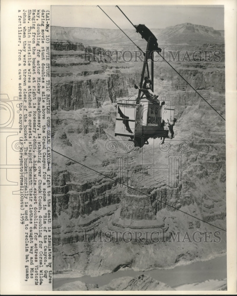 1954 Press Photo Movie Stunt Doubles in Bat Guano Bucket for &quot;Rim of the Canyon&quot;