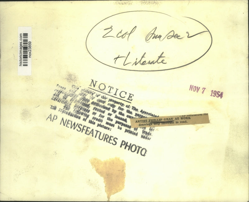 Load image into Gallery viewer, 1954 Press Photo Artist Phillip Gray at work, drawings help illiterate to read
