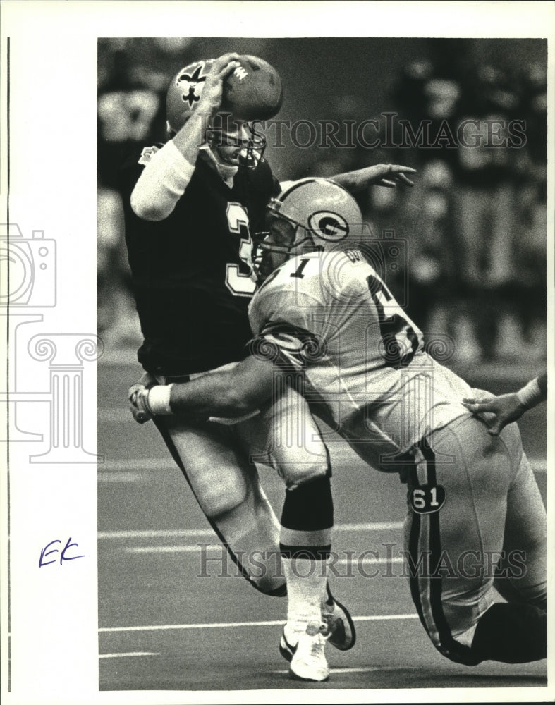 Load image into Gallery viewer, 1988 Press PhotoNew Orleans Saints Football Player Bobby Hebert gets sacked
