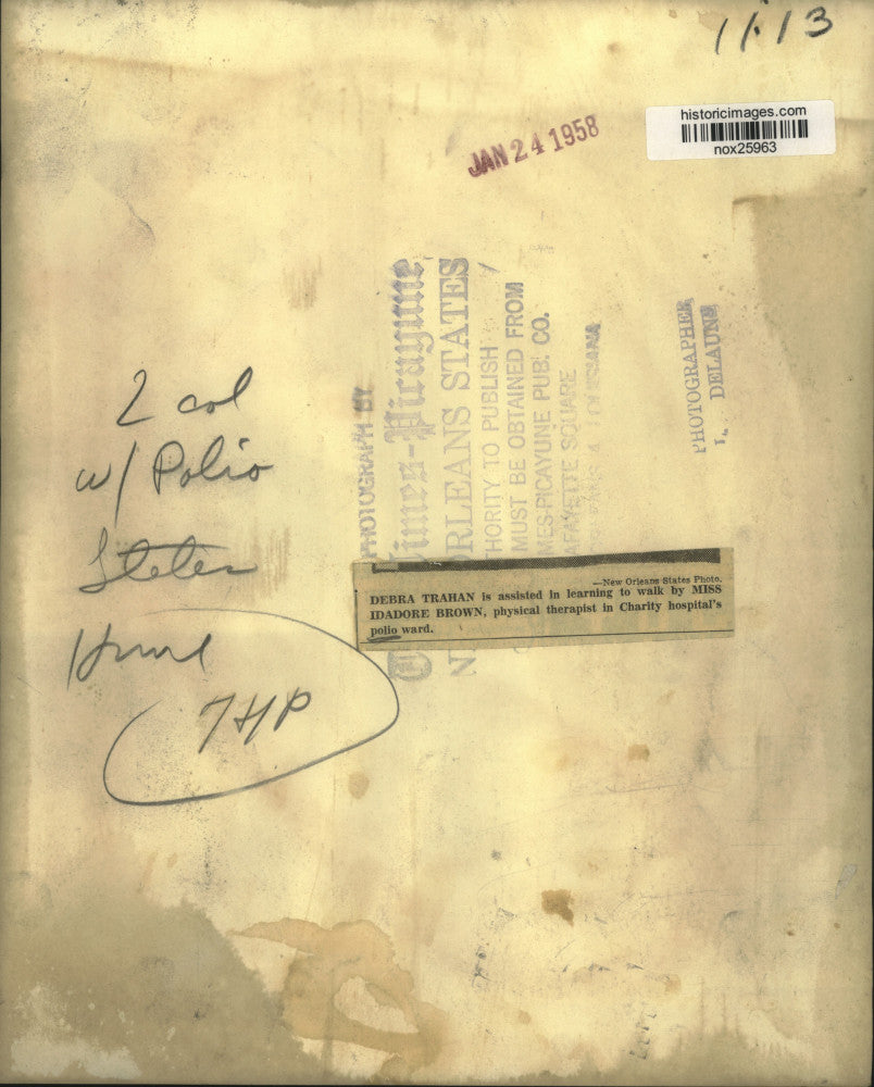 1958 Press Photo Debra Trahan is assisted in walking by Miss Isadore Brown