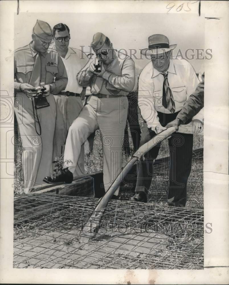1950 Press Photo Andrew J. Higgins, Senior sprays concrete from high power hose
